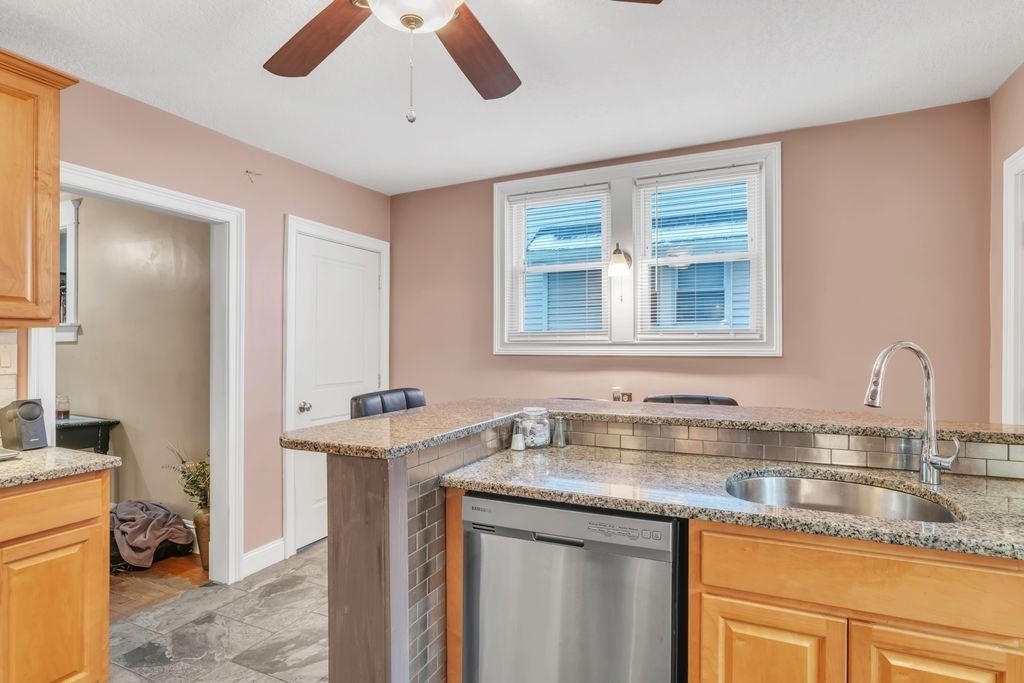 754 White Street Springfield, MA 01108 - Photo 7 of 41 a kitchen with stainless steel appliances granite countertop a sink and a window
