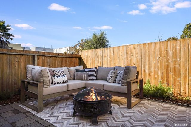 a couch sitting in the middle of a patio