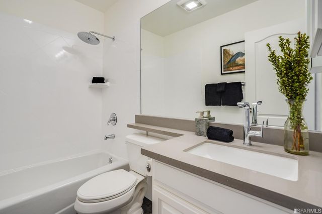 a bathroom with a sink a toilet and a bathtub