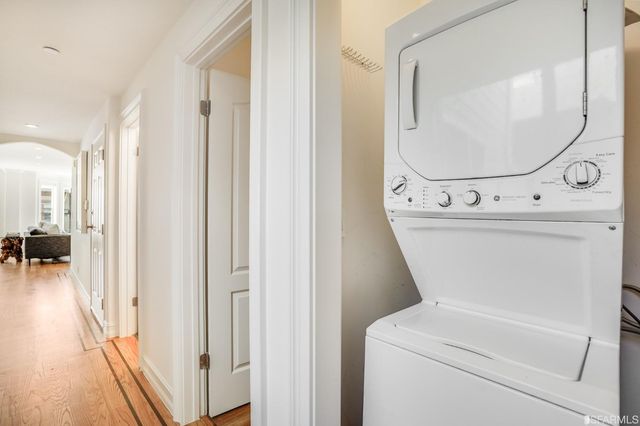 a view of a hallway with washer and dryer