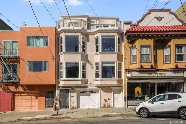 a view of a car park in front of house
