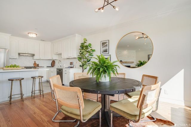 a dining room with furniture and garden view