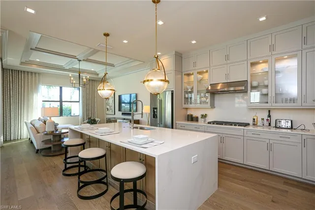 a kitchen with sink cabinets and dining table