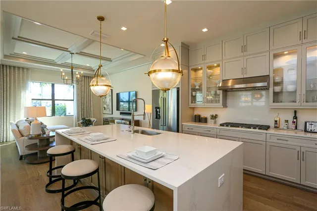 a kitchen with a table chairs stove and cabinets