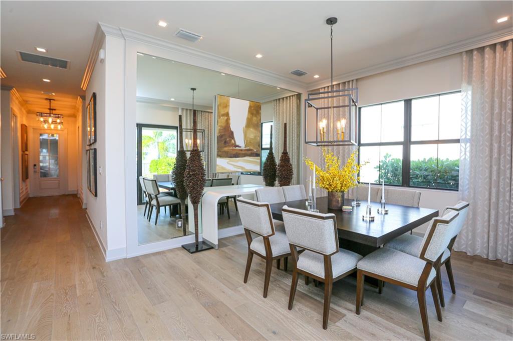 14727 Kingfisher Loop Naples, FL 34120 - Photo 34 of 50 a dining room with furniture window wooden floor