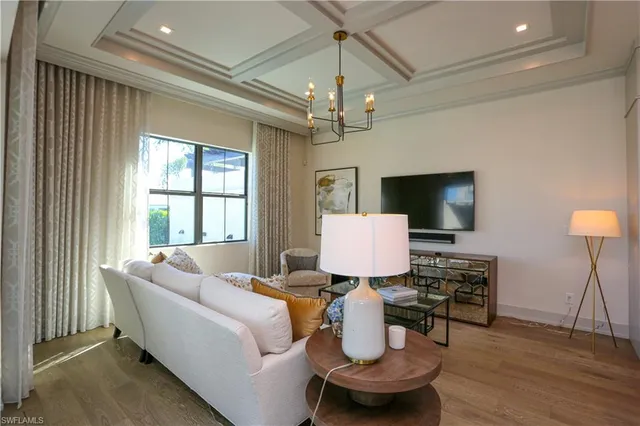 a living room with fireplace furniture and a flat screen tv