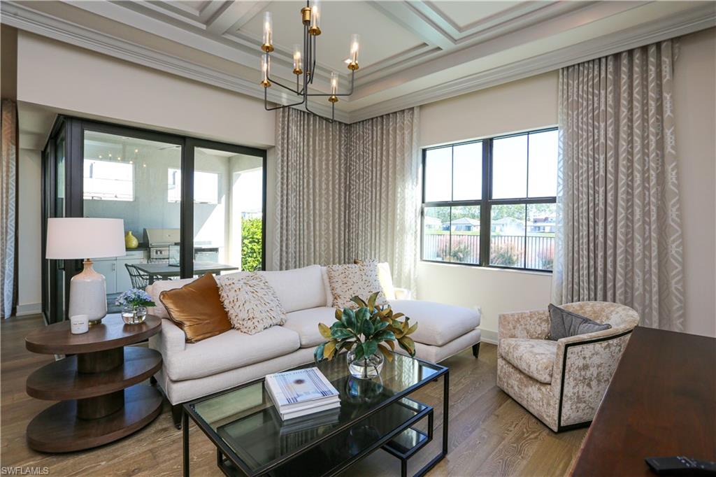 14727 Kingfisher Loop Naples, FL 34120 - Photo 45 of 50 a living room with furniture and a large window