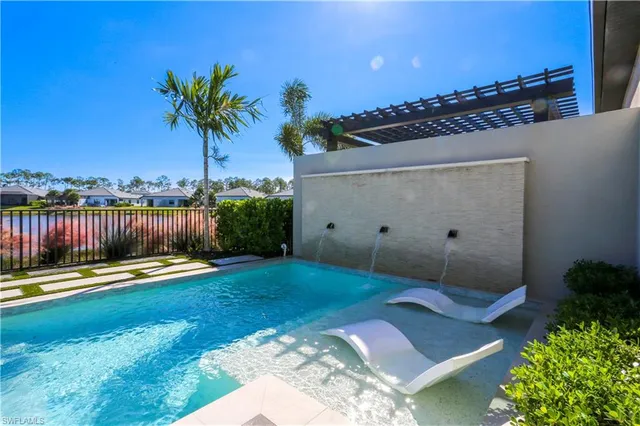 a backyard with a table and chairs