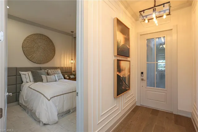 a bedroom with a bed and a mirror