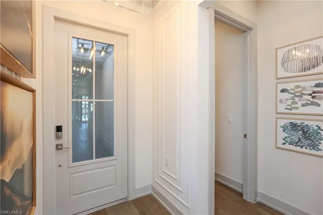 an entryway with wooden floor