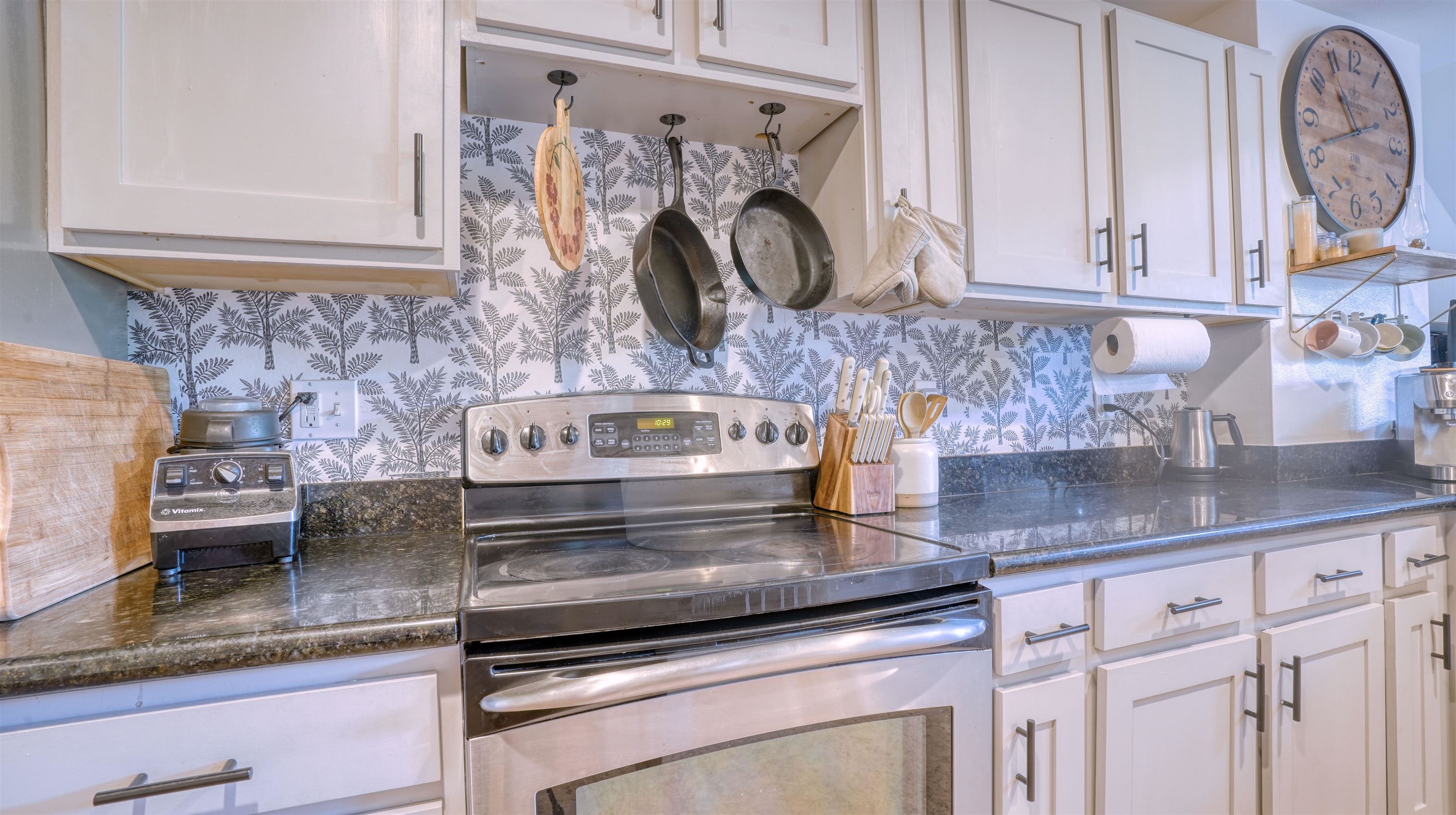 3710 Lower Honoapiilani Road, Unit F44 Lahaina, HI 96761 - Photo 14 of 41 a kitchen with granite countertop a sink a stove and cabinets