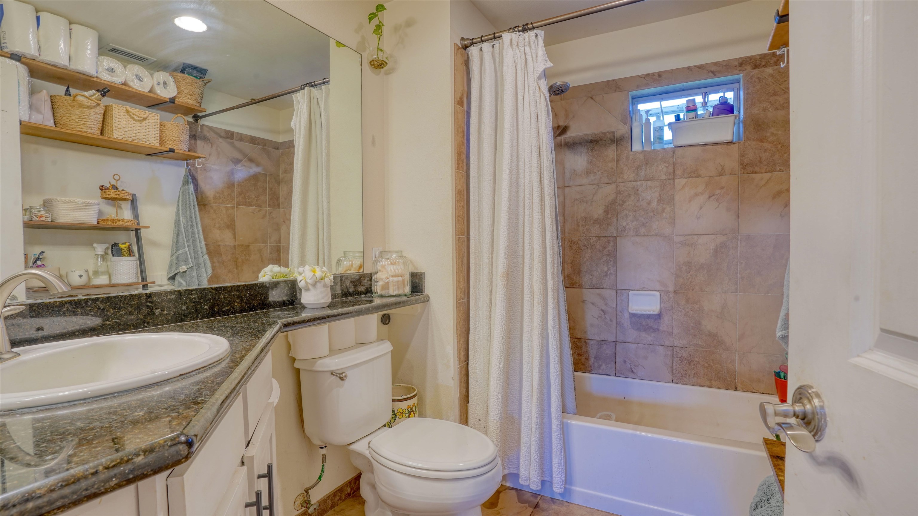 3710 Lower Honoapiilani Road, Unit F44 Lahaina, HI 96761 - Photo 17 of 41 a bathroom with a granite countertop sink toilet and shower