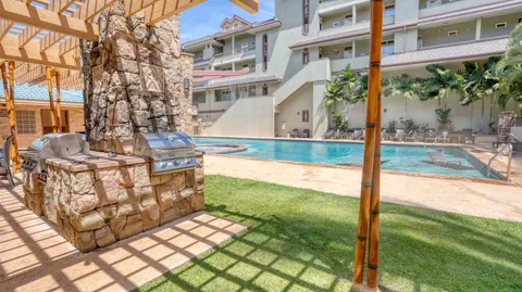 a view of a patio with couches table and chairs and potted plants