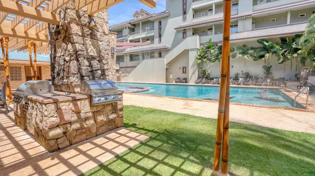 a view of a patio with couches table and chairs and potted plants