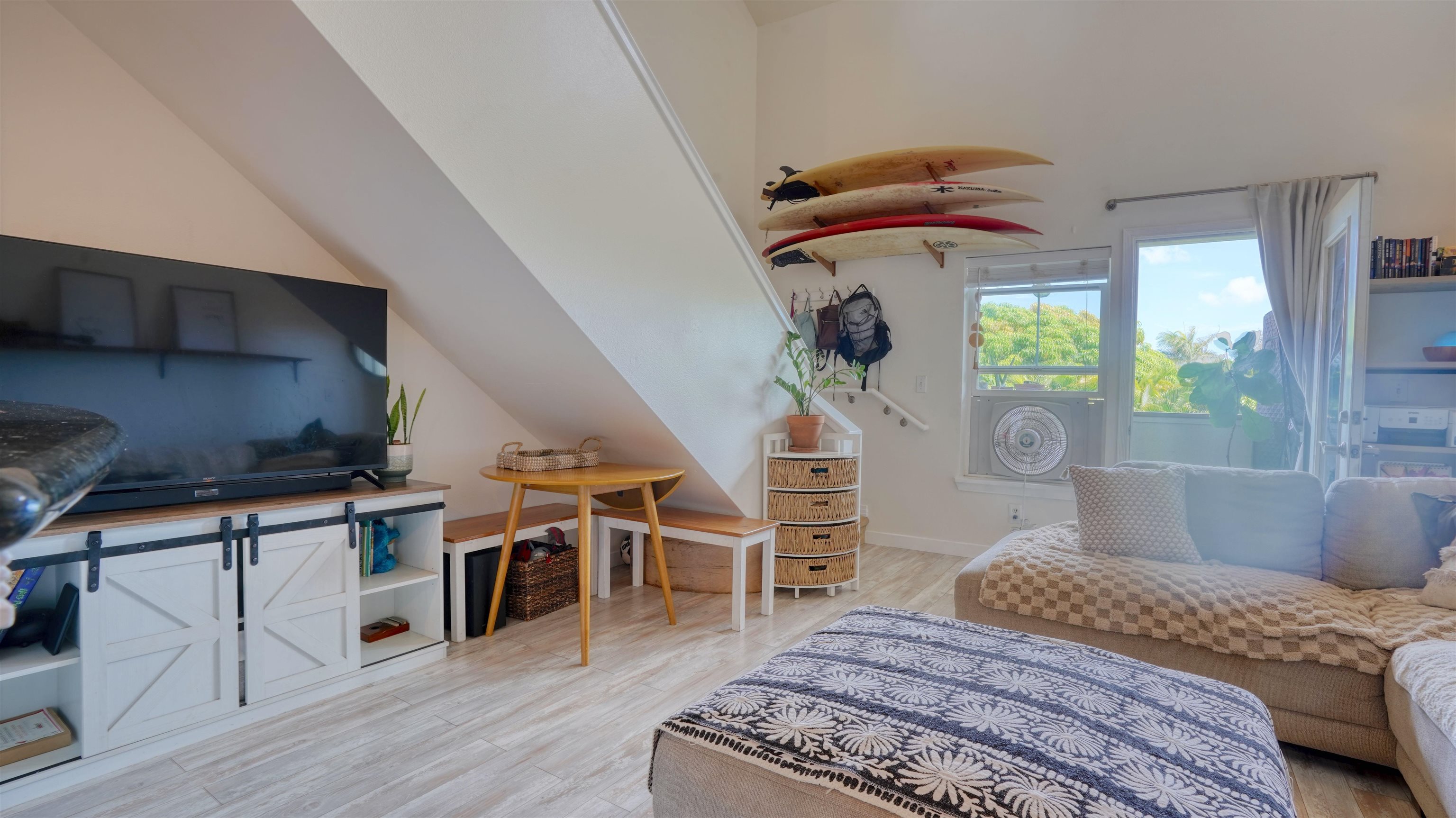 3710 Lower Honoapiilani Road, Unit F44 Lahaina, HI 96761 - Photo 5 of 41 a bedroom with furniture and a wooden floor