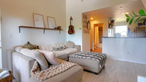 a bedroom with furniture and a window