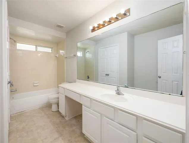 a bathroom with a sink a toilet and a bathtub