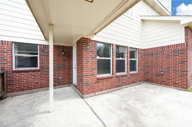 a view of backyard with entertaining space