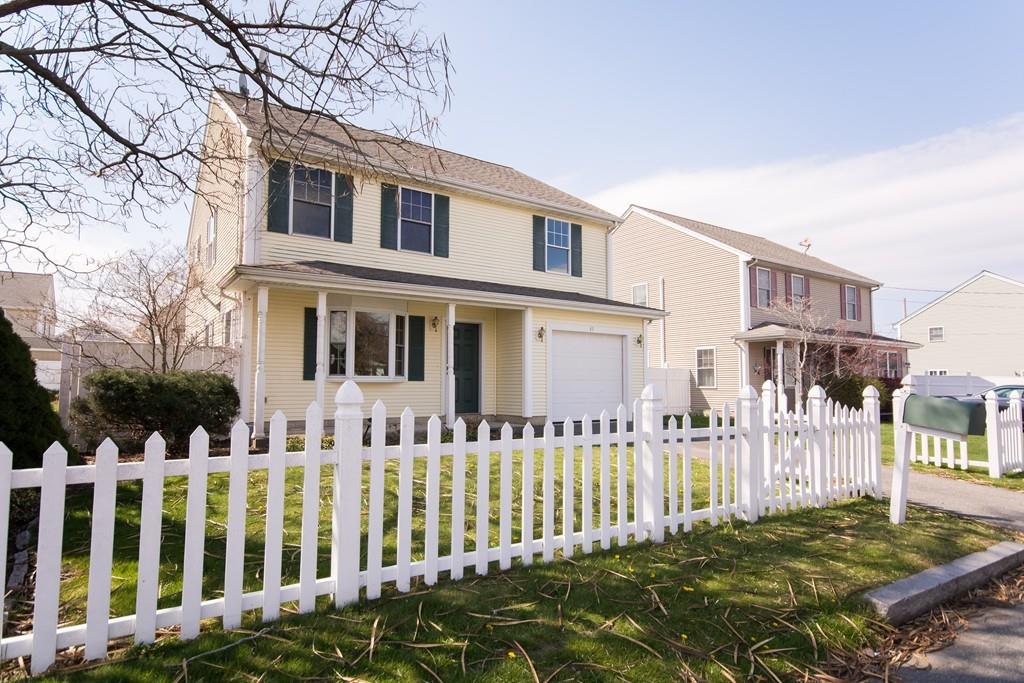 a front view of a house with a small yard