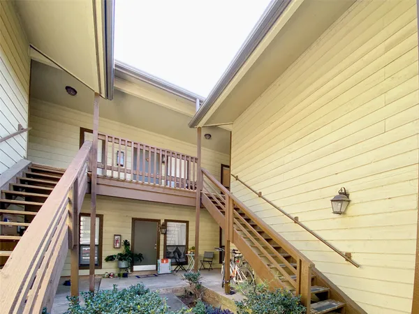 a view of balcony with furniture