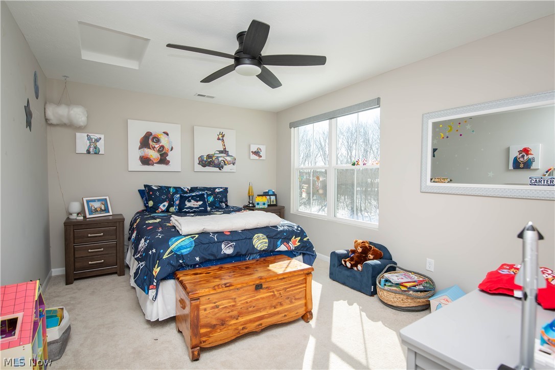 150 Seamore Road Aurora, OH 44202 - Photo 42 of 50 Carpeted bedroom featuring a ceiling fan and attic access