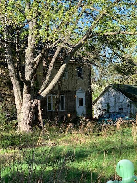 319 Fairfield Road Freehold, NJ 07728 - Photo 3 of 6 a backyard of a house with lots of green space