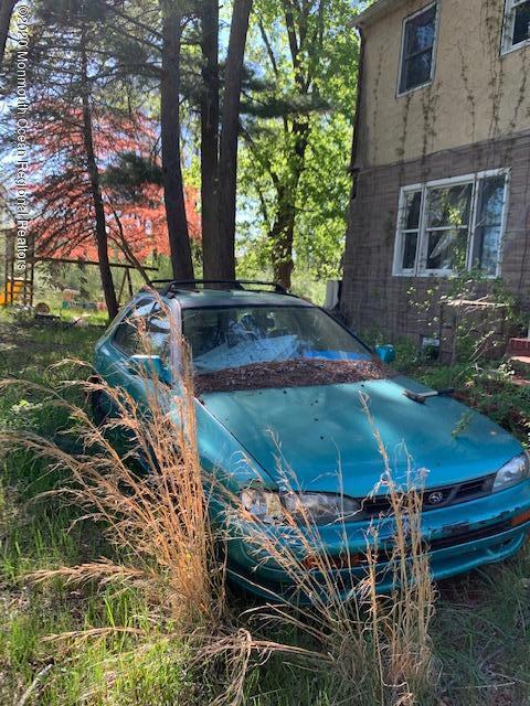 319 Fairfield Road Freehold, NJ 07728 - Photo 4 of 6 a view of a backyard of the house
