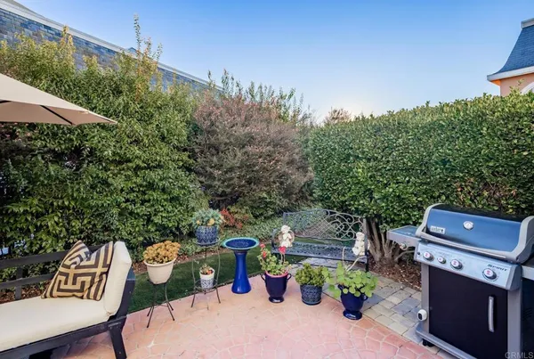 a view of a chairs and table in a patio