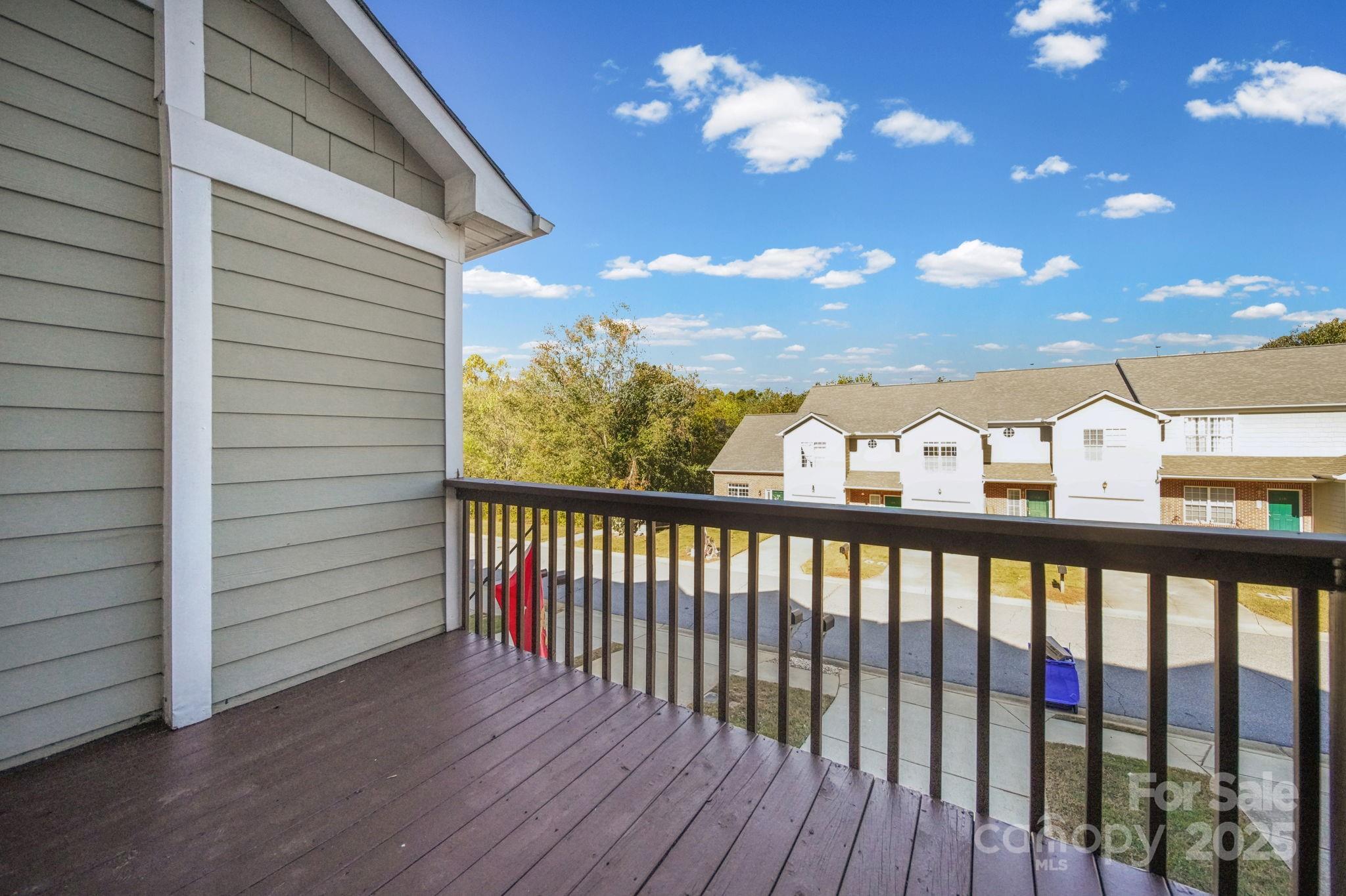 115 Sun Ridge Drive Mooresville, NC 28117 - Photo 13 of 30 a view of a balcony with wooden fence