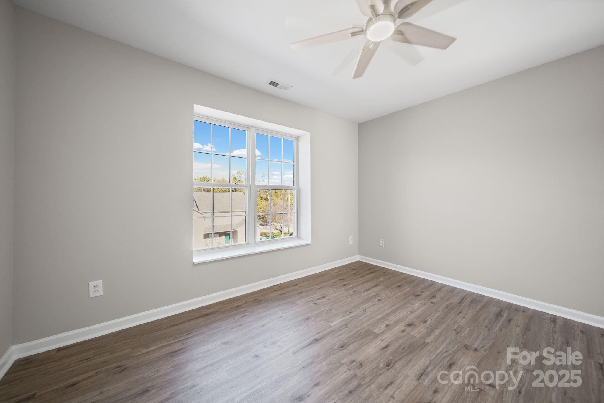115 Sun Ridge Drive Mooresville, NC 28117 - Photo 25 of 30 wooden floor in an empty room with a window