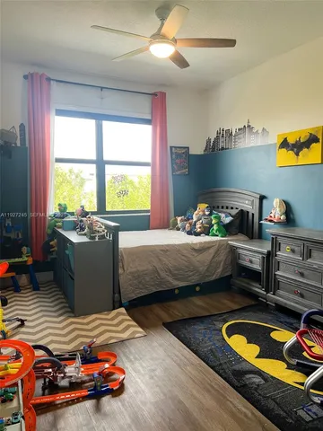 a bedroom with bed and window