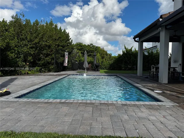 a backyard of a house with lots of green space