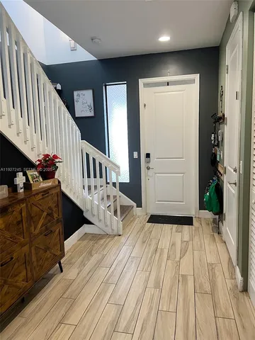 a view of livingroom with furniture and stairs
