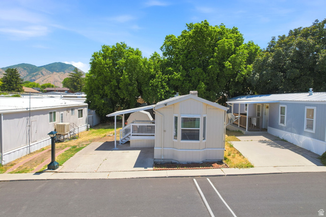 1525 South 400 East, Unit 13 Springville, UT 84663 - Photo 5 of 32 Single-story residence featuring a bay window, covered porch, and carport