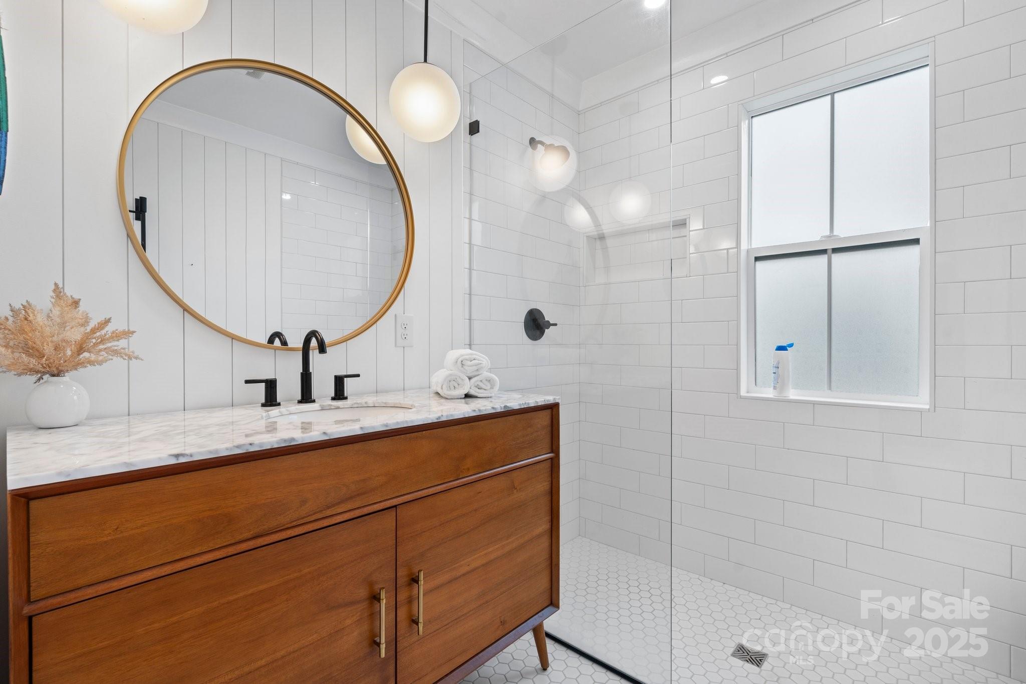 2704 Kool Park Road Northeast Hickory, NC 28601 - Photo 12 of 23 a bathroom with a sink and a mirror