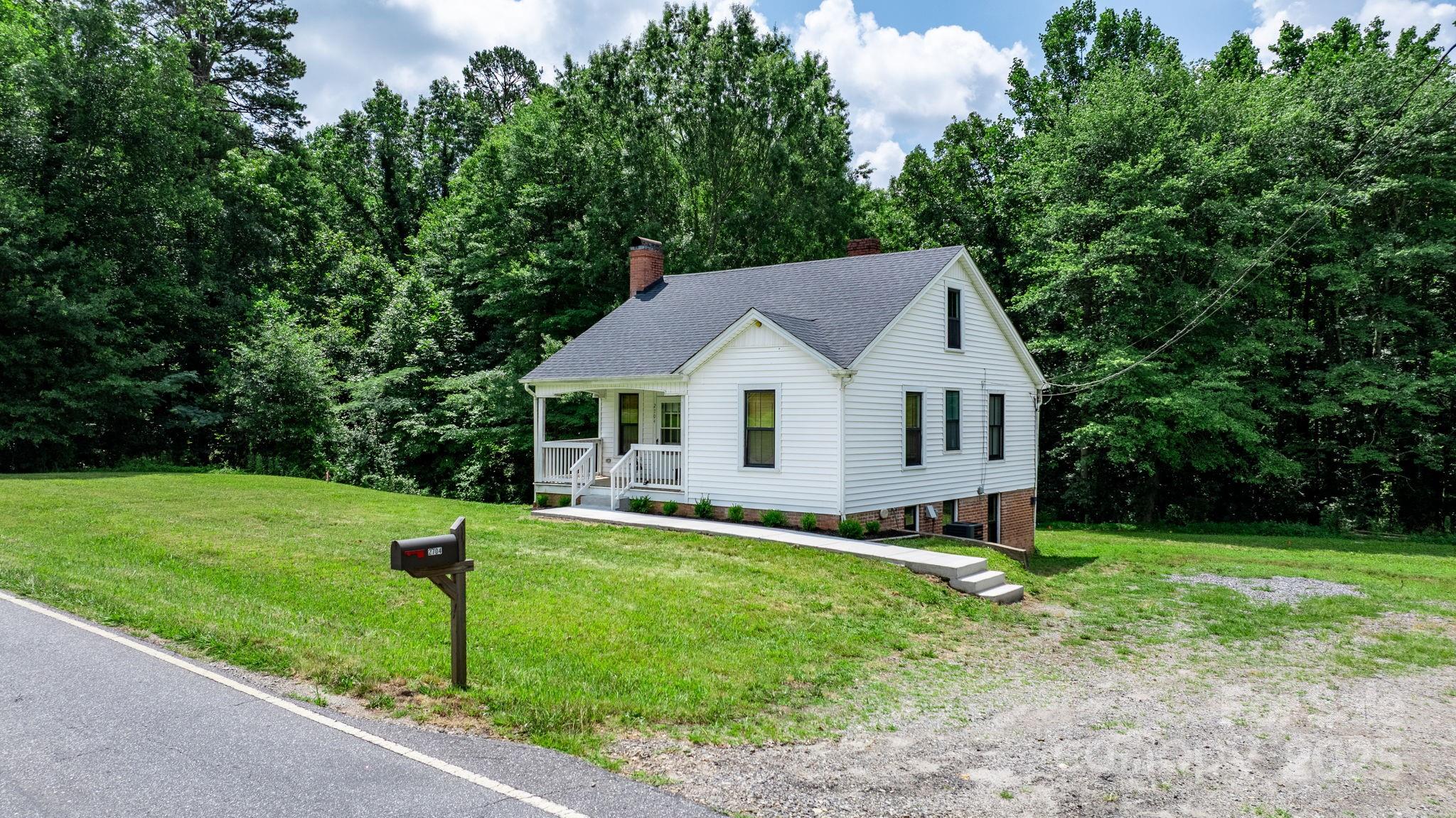 2704 Kool Park Road Northeast Hickory, NC 28601 - Photo 20 of 23 a view of a house with a yard