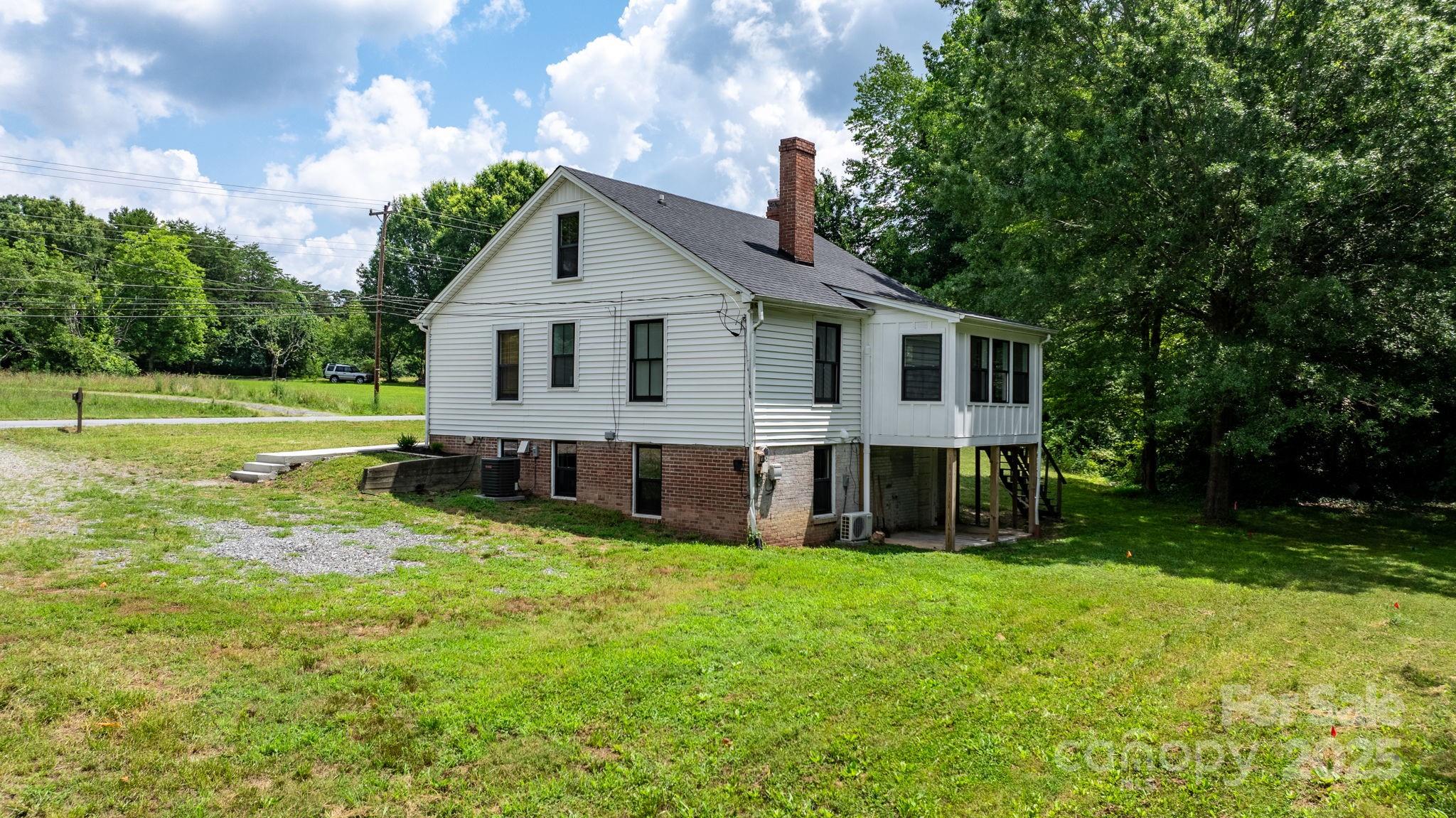 2704 Kool Park Road Northeast Hickory, NC 28601 - Photo 22 of 23 a view of a house with a yard and sitting area