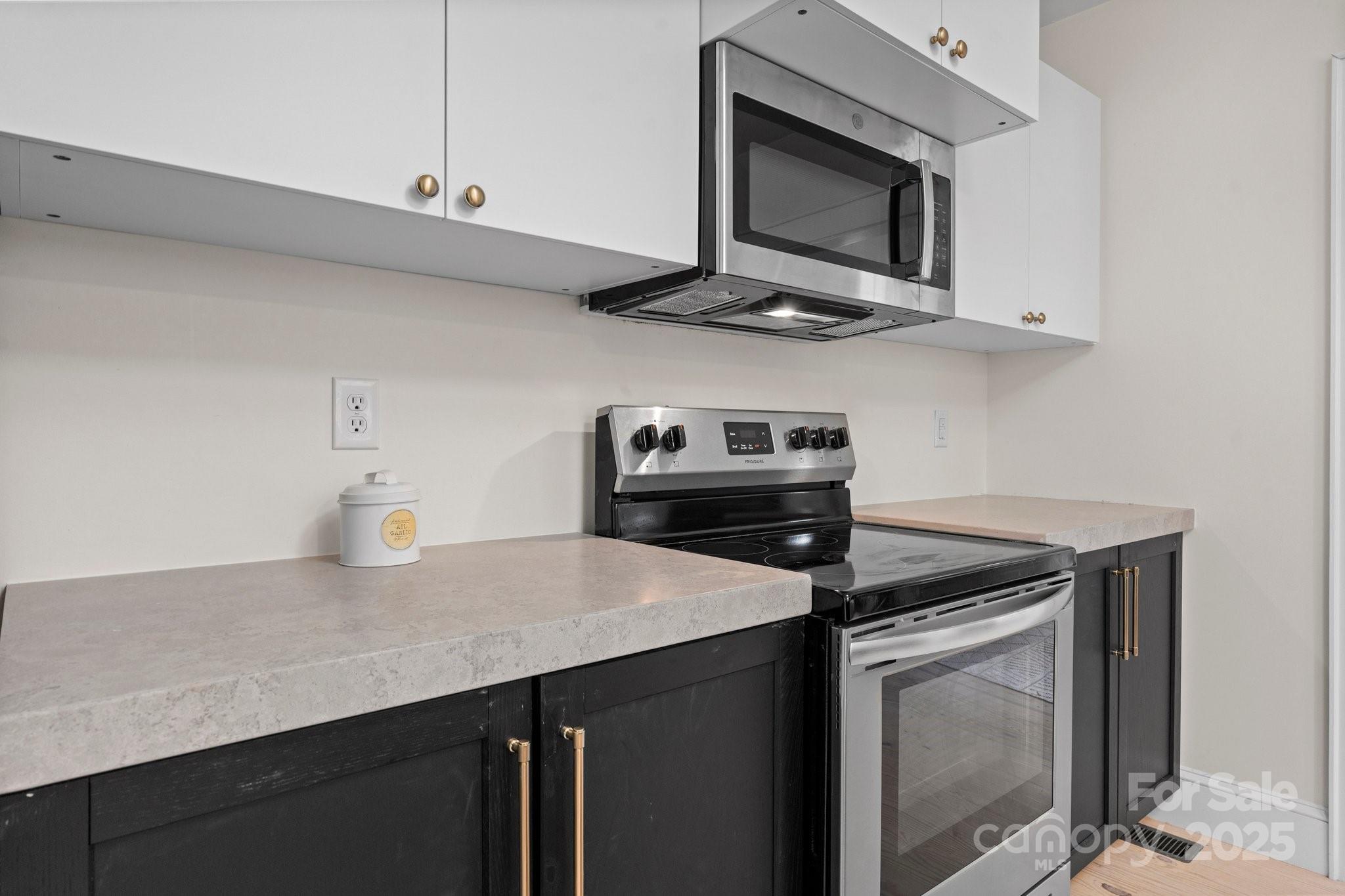 2704 Kool Park Road Northeast Hickory, NC 28601 - Photo 8 of 23 a kitchen with a stove microwave and sink