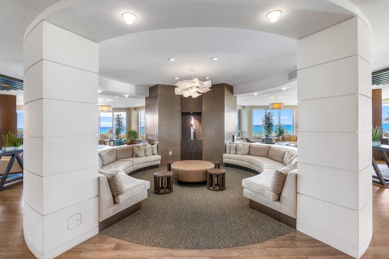550 South Ocean Boulevard, Unit 2001 Boca Raton, FL 33432 - Photo 17 of 33 a living room with furniture and a chandelier