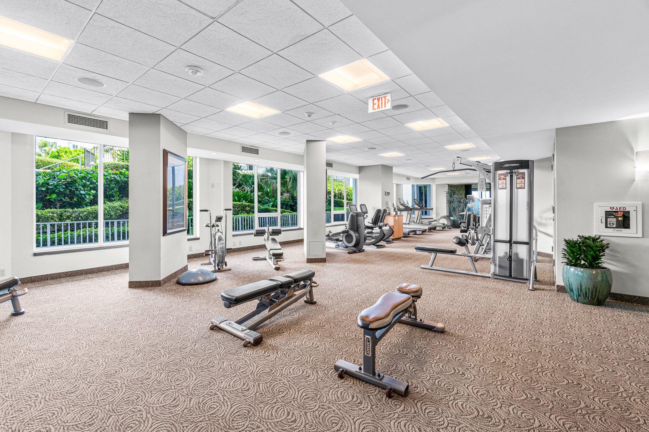 550 South Ocean Boulevard, Unit 2001 Boca Raton, FL 33432 - Photo 21 of 33 a living room with furniture gym equipment and a large window