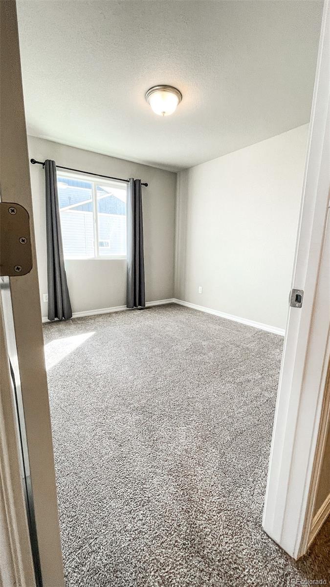 7935 Shilo Mesa Drive Colorado Springs, CO 80908 - Photo 20 of 30 a view of livingroom with window
