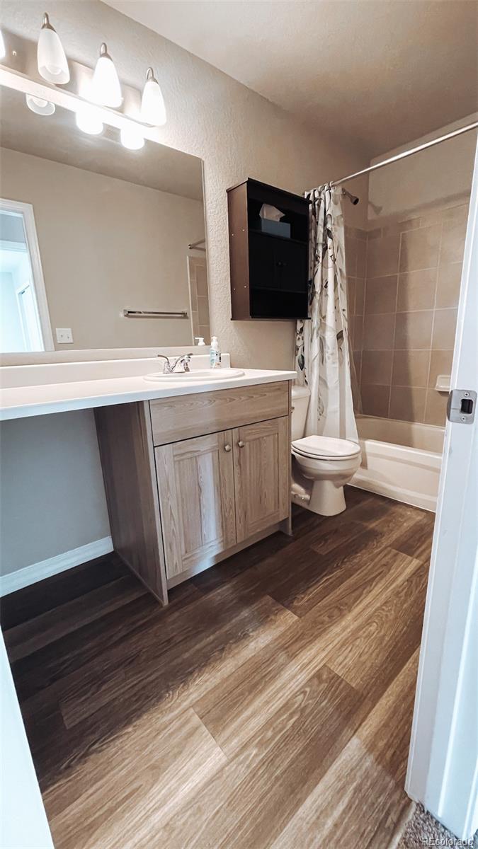 7935 Shilo Mesa Drive Colorado Springs, CO 80908 - Photo 23 of 30 a bathroom with a double vanity sink and mirror