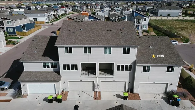 a aerial view of a house with a yard