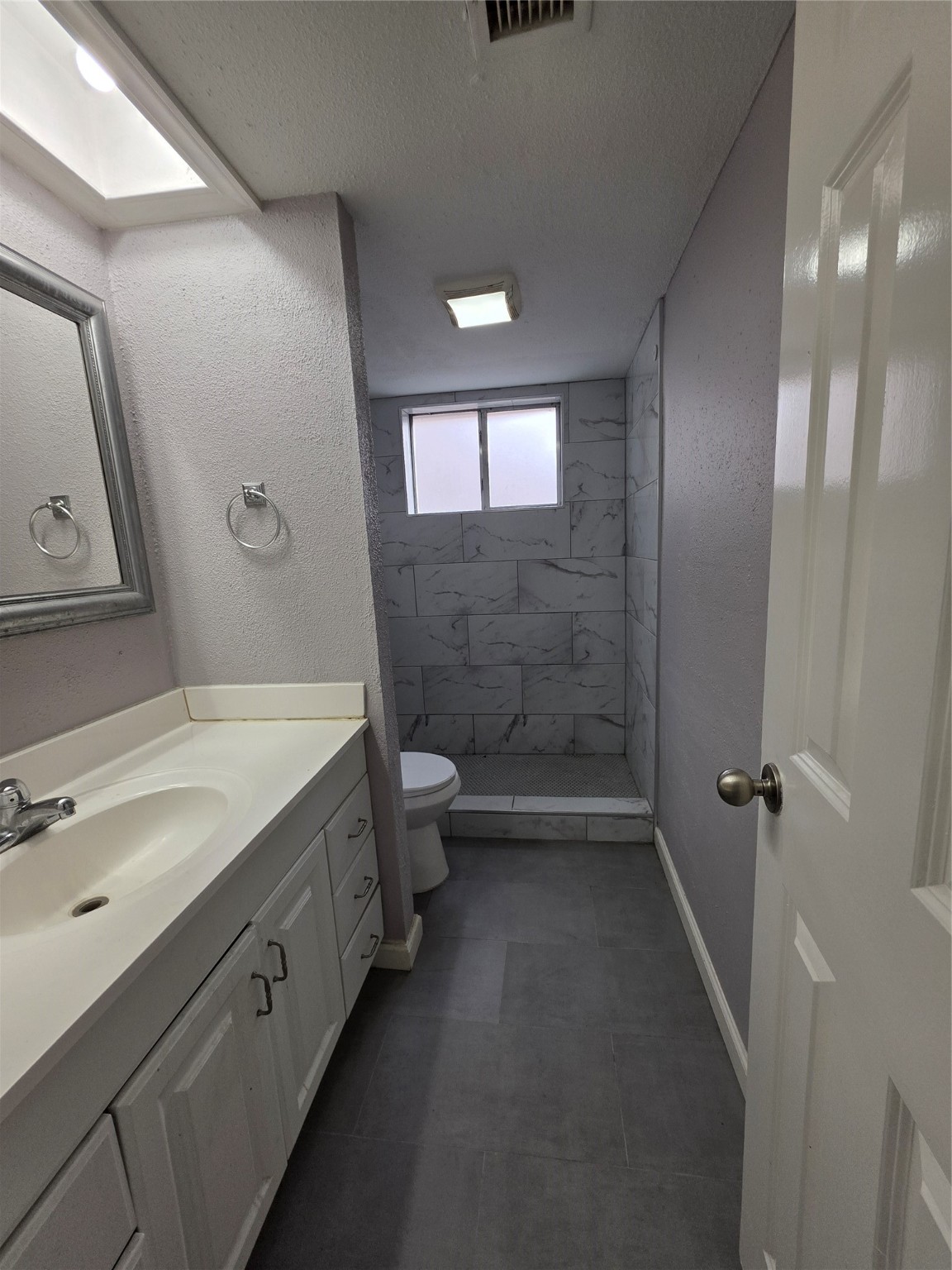 9611 Jaywood Street Houston, TX 77040 - Photo 11 of 22 a bathroom with a double vanity sink toilet and shower