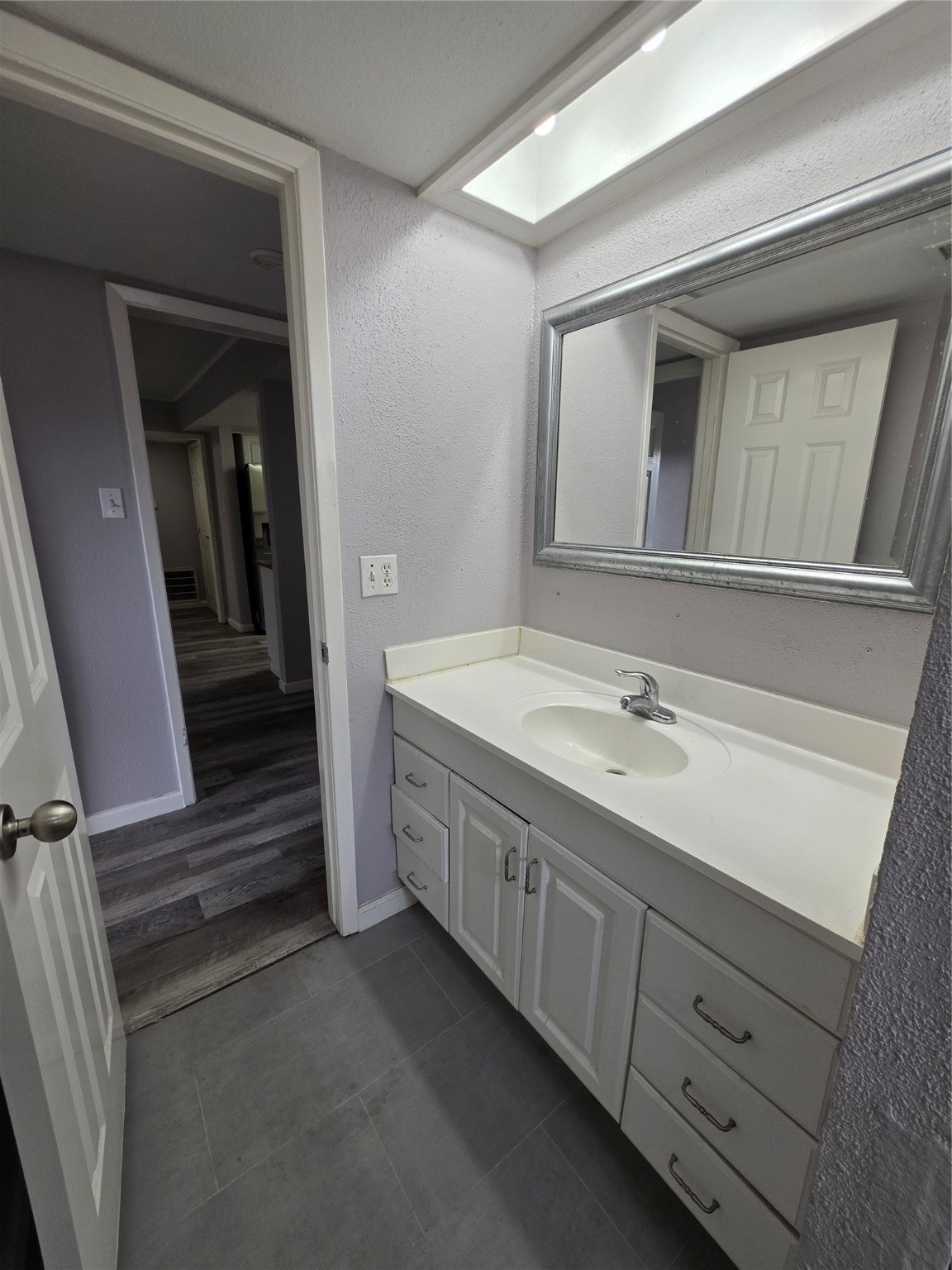 9611 Jaywood Street Houston, TX 77040 - Photo 12 of 22 a bathroom with a double vanity sink and a mirror