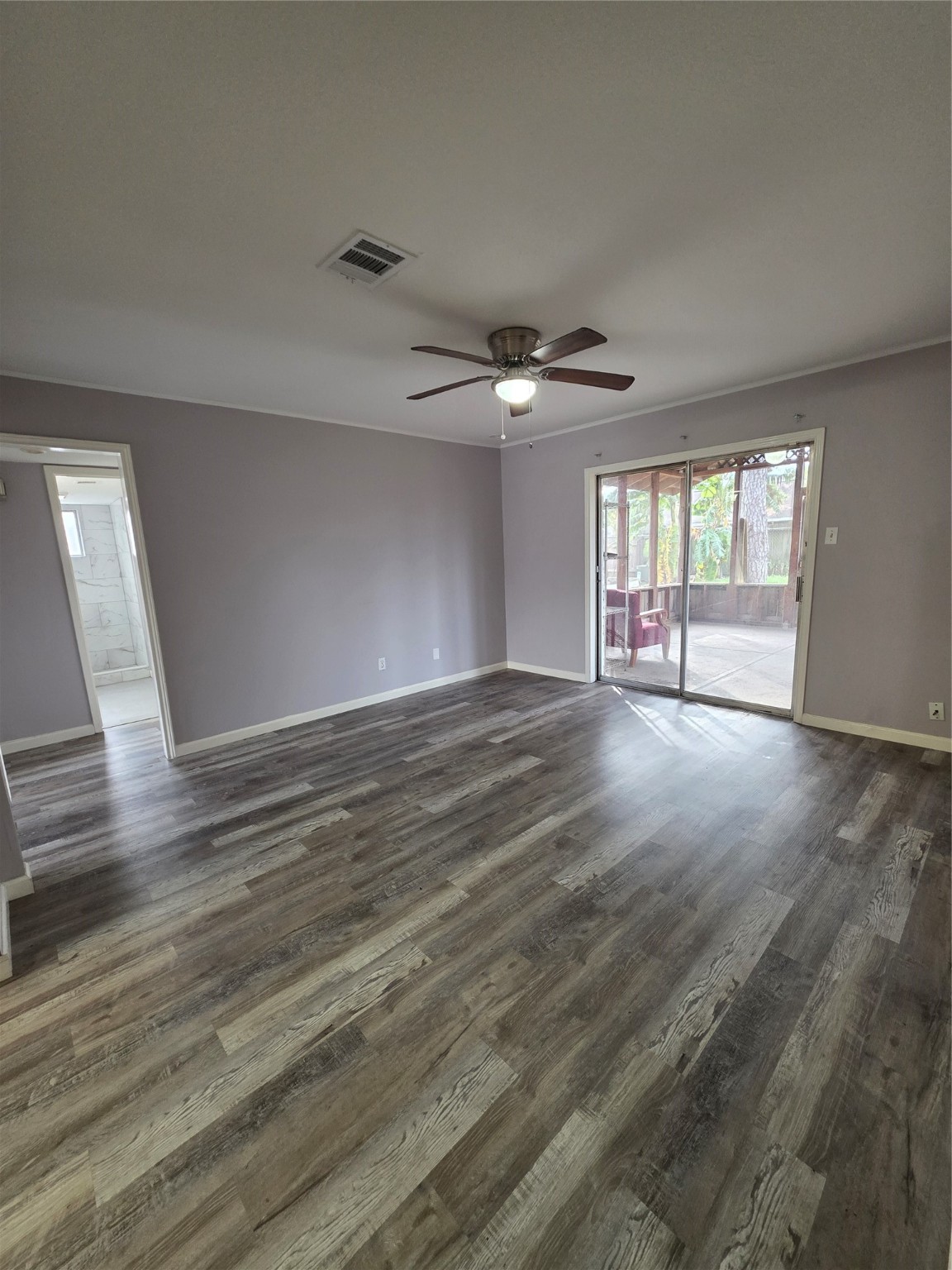9611 Jaywood Street Houston, TX 77040 - Photo 2 of 22 wooden floor in an empty room with a window