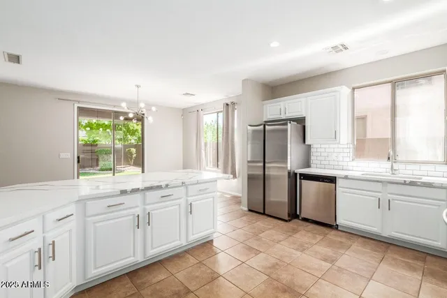 a kitchen with a sink and refrigerator