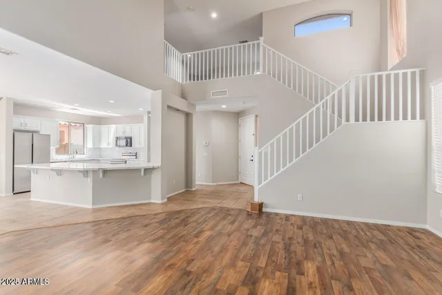 a view of an entryway with wooden floor