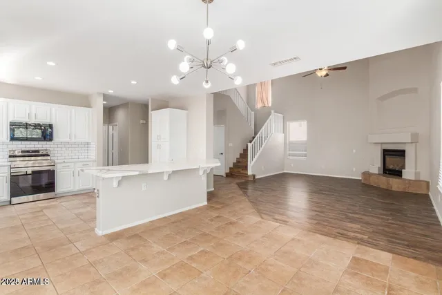 a view of a kitchen with a sink and a stove top oven