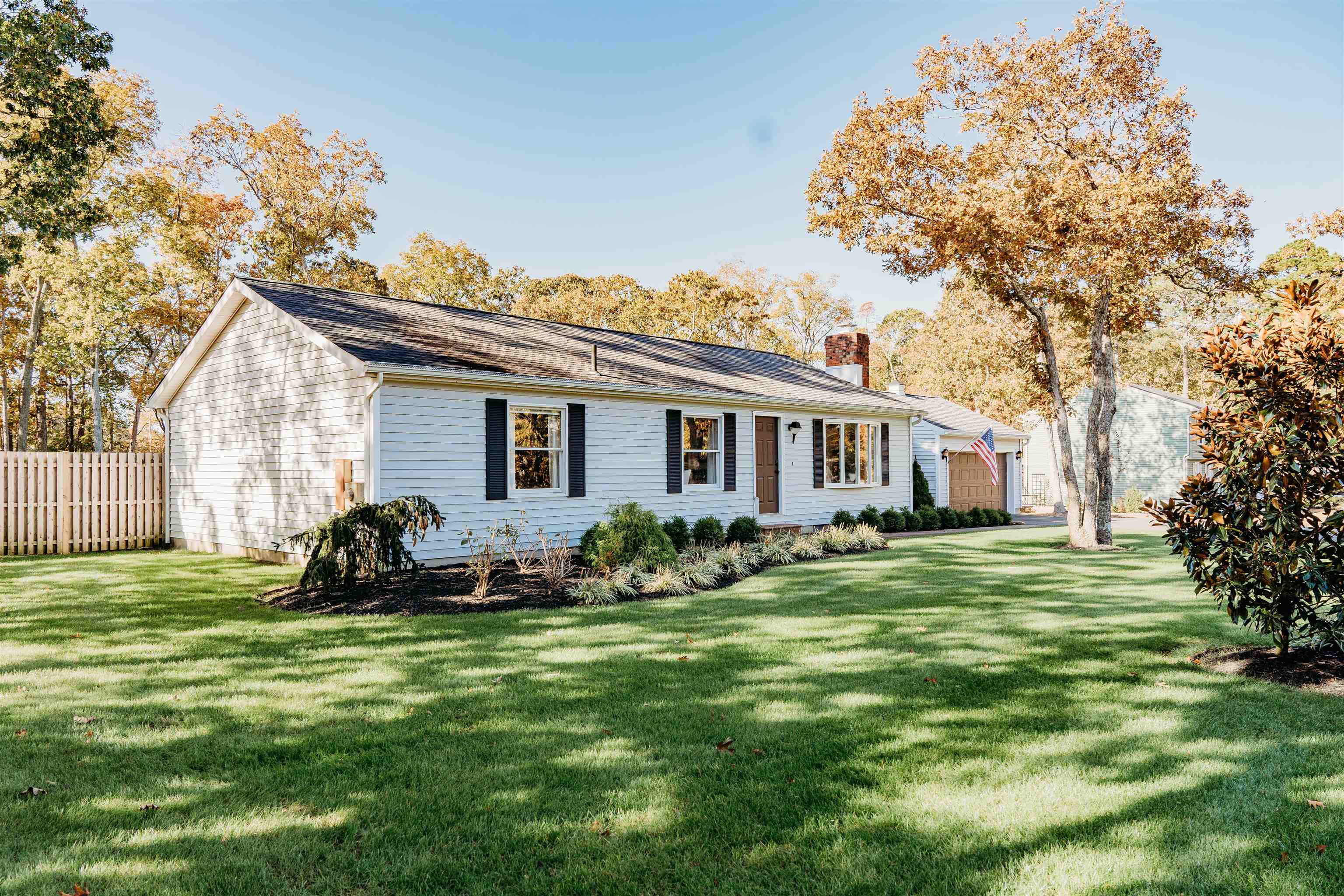 8 Indian Walk Road Ocean View, NJ 08230 - Photo 3 of 44 a front view of a house with a garden